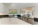 Kitchen with a view of the backyard and pool through a window at 3514 62Nd E St, Bradenton, FL 34208