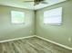Spacious bedroom with wood-look flooring and neutral walls at 360 Flamingo Rd, Venice, FL 34293
