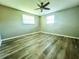 Large bedroom with wood-look floors and neutral walls at 360 Flamingo Rd, Venice, FL 34293