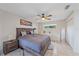 Main bedroom with king bed and ceiling fan at 3712 62Nd E Ave, Bradenton, FL 34203