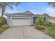 Newly renovated one story home with attached garage and beautifully landscaped lawn at 3712 62Nd E Ave, Bradenton, FL 34203