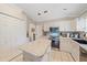 Spacious kitchen with an island and stainless steel appliances at 3712 62Nd E Ave, Bradenton, FL 34203