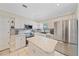 Modern kitchen with white cabinets and tile countertops at 3712 62Nd E Ave, Bradenton, FL 34203