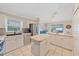Open kitchen with island and view of the backyard at 3712 62Nd E Ave, Bradenton, FL 34203