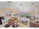 Spacious living area with a view into the kitchen and access to the lanai at 3712 62Nd E Ave, Bradenton, FL 34203