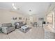 Open living area with gray sofas and dining area at 3712 62Nd E Ave, Bradenton, FL 34203