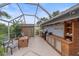 Screened-in outdoor kitchen, perfect for entertaining at 3712 62Nd E Ave, Bradenton, FL 34203
