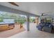 Relaxing patio with hot tub and covered seating area at 3712 62Nd E Ave, Bradenton, FL 34203