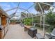 Large screened-in patio with hot tub and fire pit at 3712 62Nd E Ave, Bradenton, FL 34203
