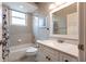 Clean bathroom with a shower/tub combo and granite vanity at 3826 E 155Th E Ave, Parrish, FL 34219