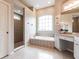 Spa-like bathroom with soaking tub, shower, and granite vanity at 3826 E 155Th E Ave, Parrish, FL 34219