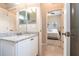 Bathroom features granite countertop vanity and view of bedroom at 3826 E 155Th E Ave, Parrish, FL 34219