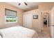 Bedroom with queen-size bed and access to the backyard at 3826 E 155Th E Ave, Parrish, FL 34219