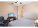 Bedroom with a king-size bed, TV, and comfortable recliner at 3826 E 155Th E Ave, Parrish, FL 34219