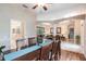Dining room with a wooden table and chairs, near kitchen at 3826 E 155Th E Ave, Parrish, FL 34219