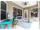 Covered lanai offers comfortable seating and pool views at 3826 E 155Th E Ave, Parrish, FL 34219