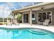 Inviting pool area with screened enclosure and lounge chairs at 3826 E 155Th E Ave, Parrish, FL 34219