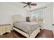 Cozy bedroom with double bed, wooden dresser, and ceiling fan at 4110 Central Sarasota Pkwy # 136, Sarasota, FL 34238