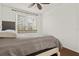 Comfortable bedroom with a double bed and large windows at 4110 Central Sarasota Pkwy # 136, Sarasota, FL 34238