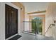 Condo entryway with dark brown door and stairs at 4110 Central Sarasota Pkwy # 136, Sarasota, FL 34238