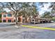 Community entrance with covered parking and landscaping at 4110 Central Sarasota Pkwy # 136, Sarasota, FL 34238