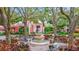 Peaceful courtyard with a central fountain and benches, surrounded by trees at 4110 Central Sarasota Pkwy # 136, Sarasota, FL 34238