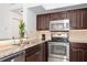 Modern kitchen with granite counters and stainless steel appliances at 4110 Central Sarasota Pkwy # 136, Sarasota, FL 34238
