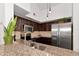 Modern kitchen with granite counters and stainless steel appliances at 4110 Central Sarasota Pkwy # 136, Sarasota, FL 34238