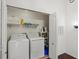 Convenient laundry closet with washer, dryer, and shelving at 4110 Central Sarasota Pkwy # 136, Sarasota, FL 34238