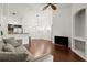 Spacious living room with hardwood floors and kitchen access at 4110 Central Sarasota Pkwy # 136, Sarasota, FL 34238