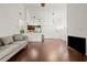 Open living room with hardwood floors and kitchen views at 4110 Central Sarasota Pkwy # 136, Sarasota, FL 34238