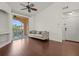 Bright living room with hardwood floors and access to balcony at 4110 Central Sarasota Pkwy # 136, Sarasota, FL 34238
