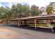 Covered parking area with additional open parking spaces at 4110 Central Sarasota Pkwy # 136, Sarasota, FL 34238
