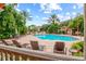 Inviting pool area with lounge chairs and landscaping at 4110 Central Sarasota Pkwy # 136, Sarasota, FL 34238