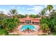 Resort-style pool with surrounding patio and lush landscaping at 4110 Central Sarasota Pkwy # 136, Sarasota, FL 34238