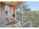 Relaxing screened balcony overlooking lush trees and landscape at 4110 Central Sarasota Pkwy # 136, Sarasota, FL 34238