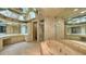 Large bathroom with a jacuzzi tub and double sinks at 415 L Ambiance Dr # A701, Longboat Key, FL 34228