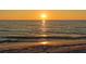 Sunset over ocean with sandy beach at 415 L Ambiance Dr # A701, Longboat Key, FL 34228