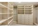 Spacious walk-in closet with ample shelving at 415 L Ambiance Dr # A701, Longboat Key, FL 34228