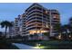 Night view of condo building, showing its architectural details at 415 L Ambiance Dr # A701, Longboat Key, FL 34228