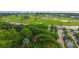 Aerial view of a green golf course with waterways at 415 L Ambiance Dr # A701, Longboat Key, FL 34228