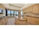 Elegant kitchen with granite counters and wood cabinets at 415 L Ambiance Dr # A701, Longboat Key, FL 34228