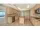 Spacious kitchen with granite island and tile floor at 415 L Ambiance Dr # A701, Longboat Key, FL 34228