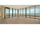 Empty living room with hardwood floors and ocean view at 415 L Ambiance Dr # A701, Longboat Key, FL 34228