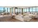 Living room with ocean view, furniture, and hardwood floors at 415 L Ambiance Dr # A701, Longboat Key, FL 34228