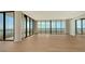 Empty living room with hardwood floors and ocean view at 415 L Ambiance Dr # A701, Longboat Key, FL 34228