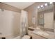 Bathroom with tub, shower, granite vanity, and tile floor at 4230 Castlebridge Ln # 1821, Sarasota, FL 34238