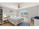 Bedroom with a queen-size bed, window, and ceiling fan at 4230 Castlebridge Ln # 1821, Sarasota, FL 34238