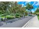 Gated community entrance with lush landscaping at 4230 Castlebridge Ln # 1821, Sarasota, FL 34238