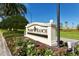 Palmer Ranch community entrance sign with landscaped flowers at 4230 Castlebridge Ln # 1821, Sarasota, FL 34238